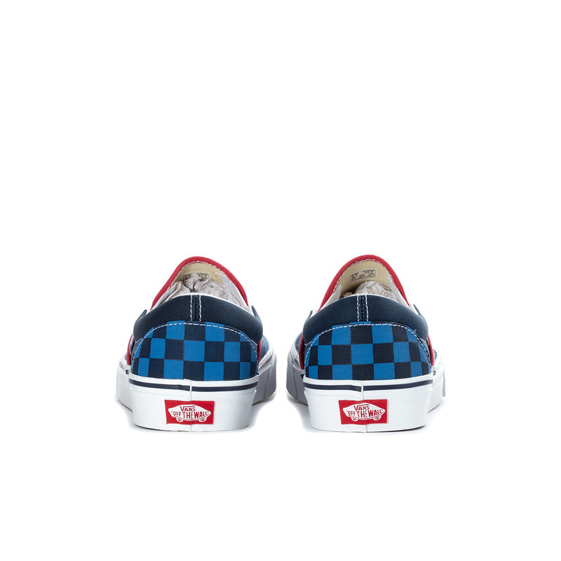 Men's slip-on sneakers with blue checkerboard back panels, red piping, white heel tab.
