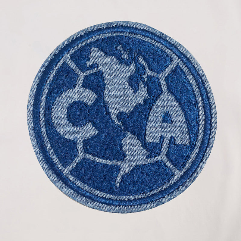 Eggshell allegiance tee close-up, blue embroidered C.A. patch