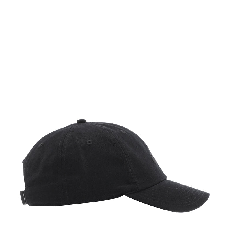 Black Nike strapback cap, side view with curved brim and eyelets.