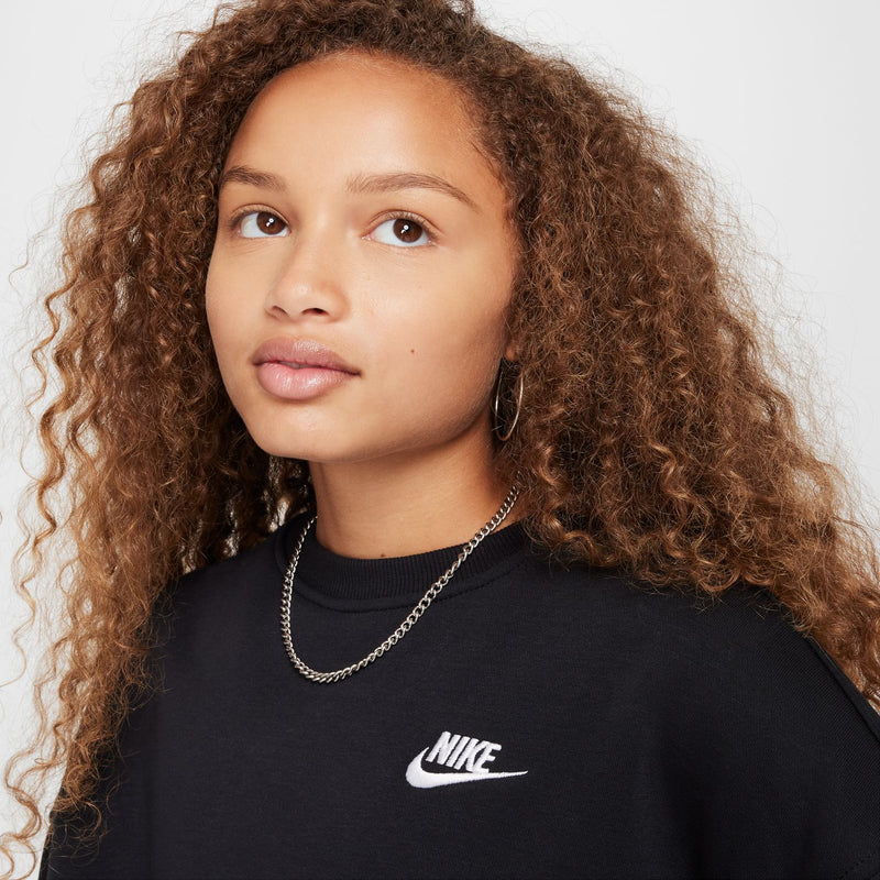 Youth black crewneck sweatshirt with Nike Swoosh logo on chest