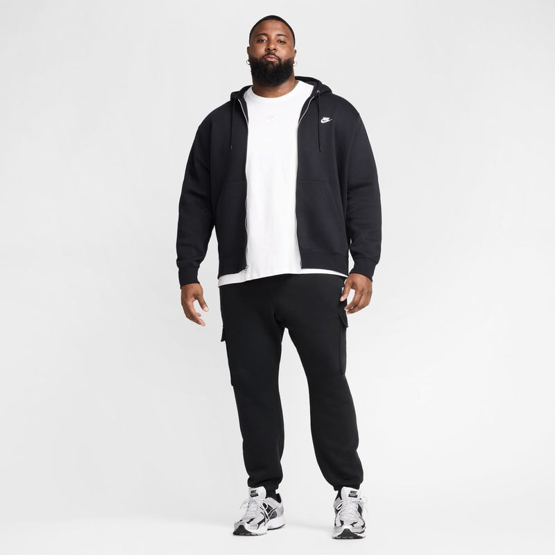 Men's black zip-front fleece hoodie over a white tee, hooded with Nike logo