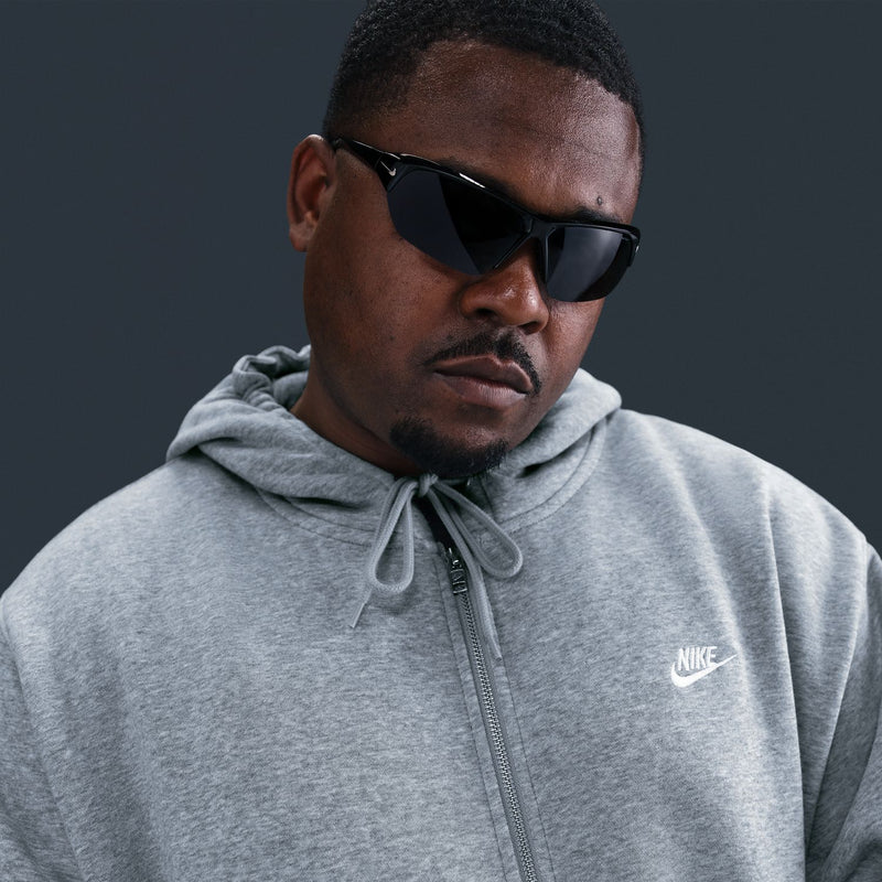 Men's grey heather zip-front fleece hoodie with hood and Nike chest logo; close-up view