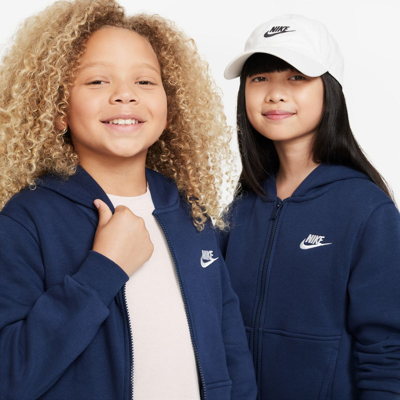 Youth navy zip-up fleece hoodie with hood and Nike logo, close-up of chest area.