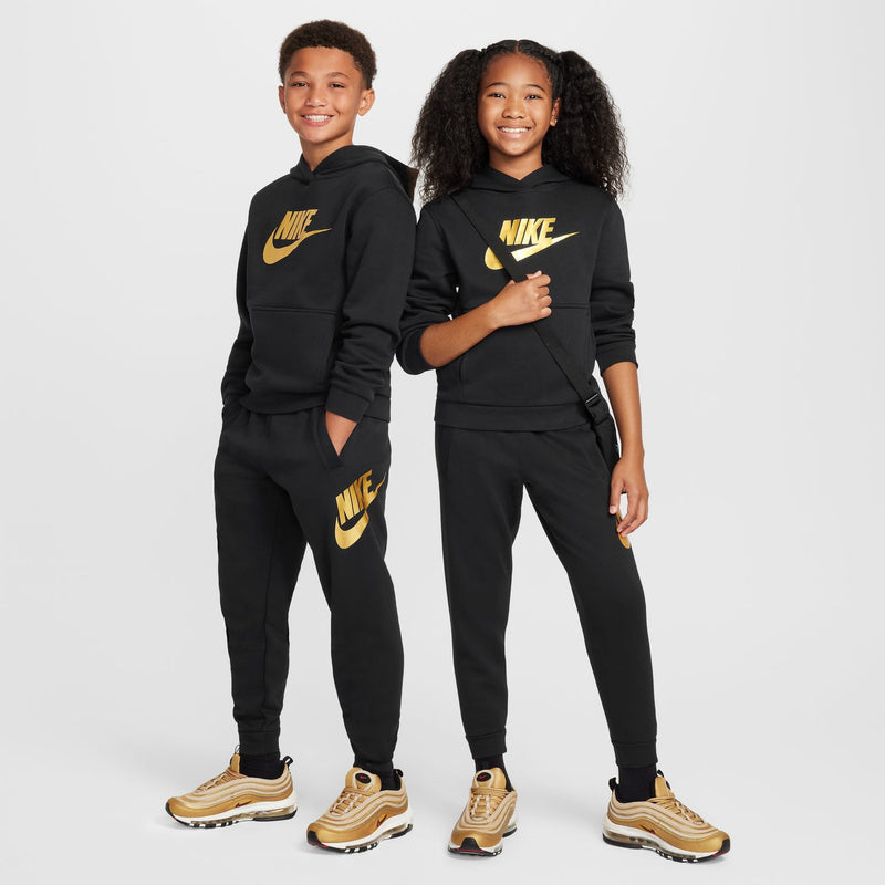 Youth black joggers with gold NIKE logo on legs