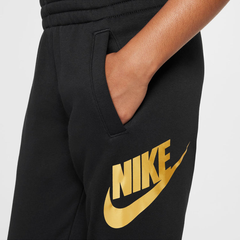 Black youth joggers with large gold NIKE swoosh logo