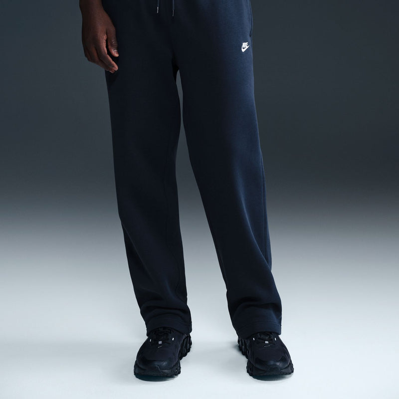 Dark blue sweatpants with open hems, elastic waistband, and cuffed leg openings