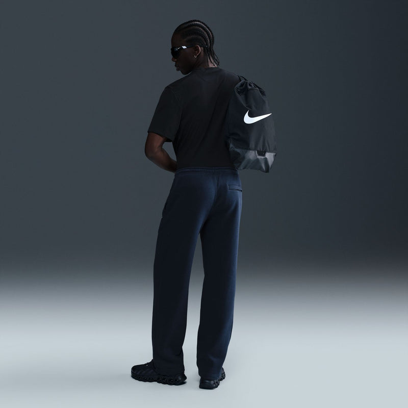 Dark blue fleece sweatpants with open hems and small white logo on the thigh