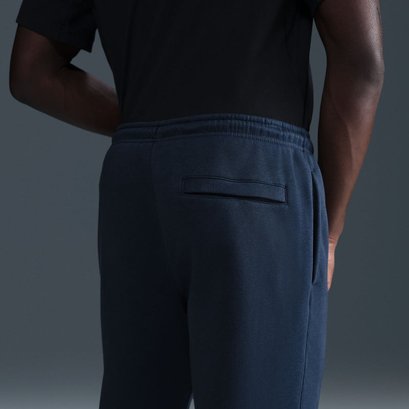 Dark blue fleece sweatpants back view with patch pocket and elastic waistband