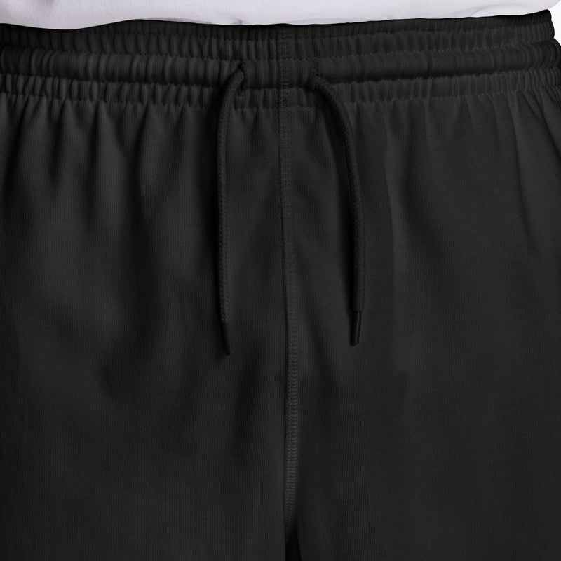 Close-up of men's black knit shorts waistband with drawstring and seam detail
