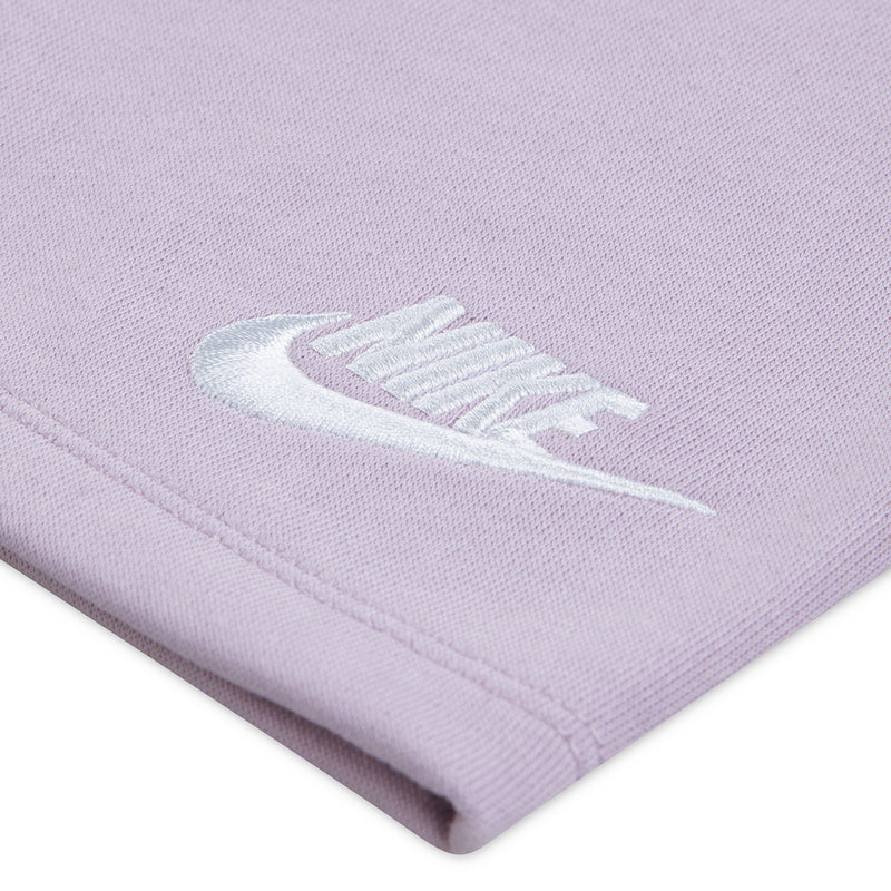 Lavender shorts fabric close-up with Nike swoosh near hem