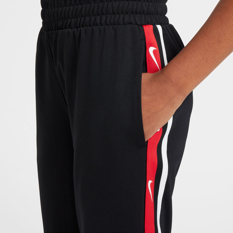 Youth black jogger pants with elastic waistband and vertical red-and-white stripe