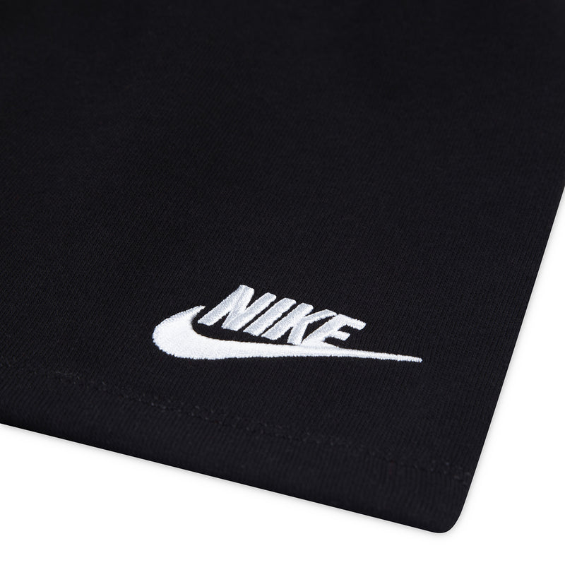 Black toddler shorts with white Nike logo on the leg
