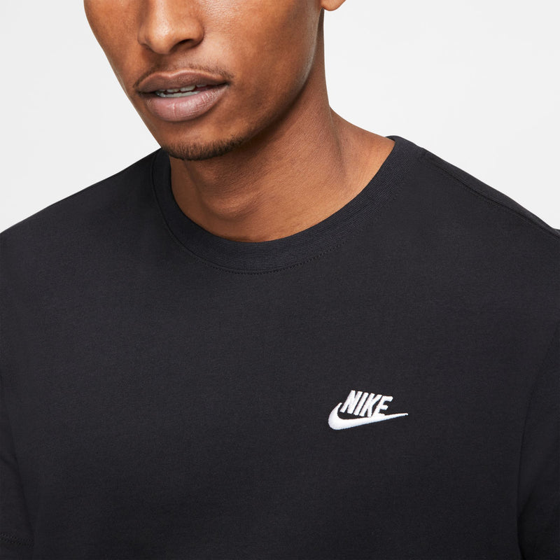 Close-up of men's black crewneck T-shirt with white Nike swoosh logo