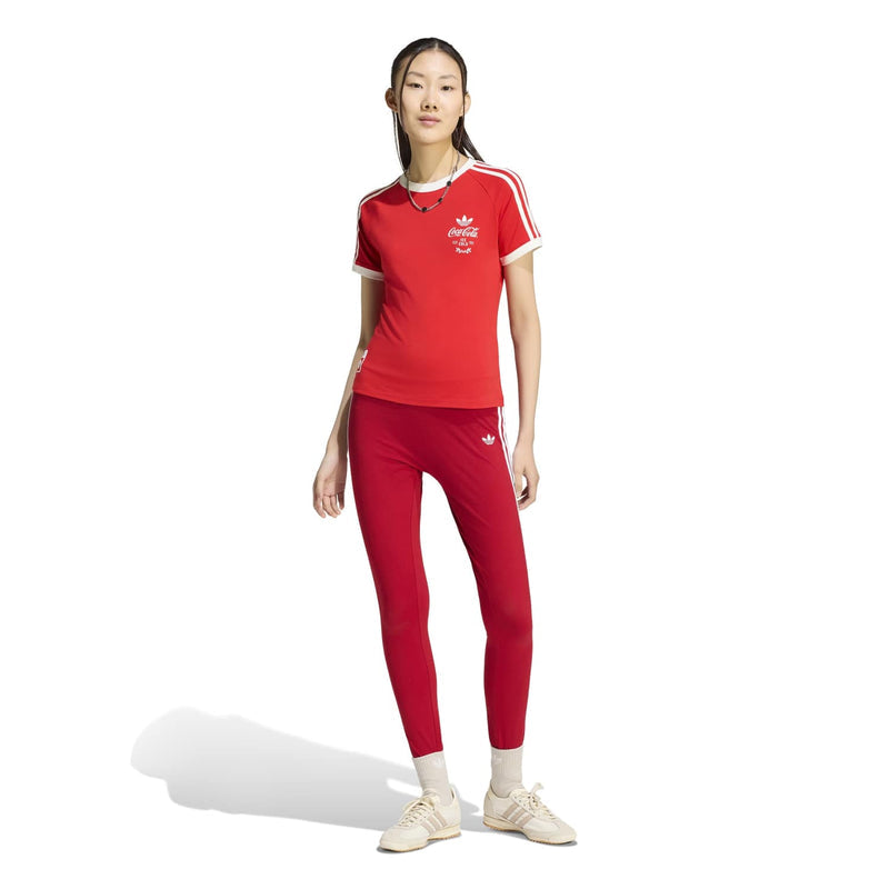 Red women's graphic tee with white stripe shoulders and Coca-Cola logo, slim fit