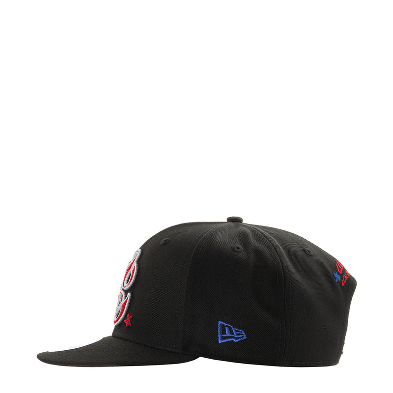 Black baseball cap with blue New Era logo and red/white emblem