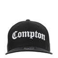 Black baseball cap with white Compton logo on the front panel and curved brim