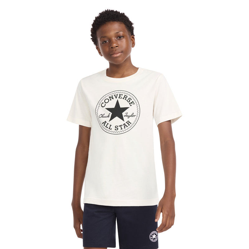 Youth off-white T-shirt with circular Converse All Star Chuck Taylor logo on chest