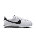 Women's white-and-black low-top sneakers with Nike swoosh and lace-up
