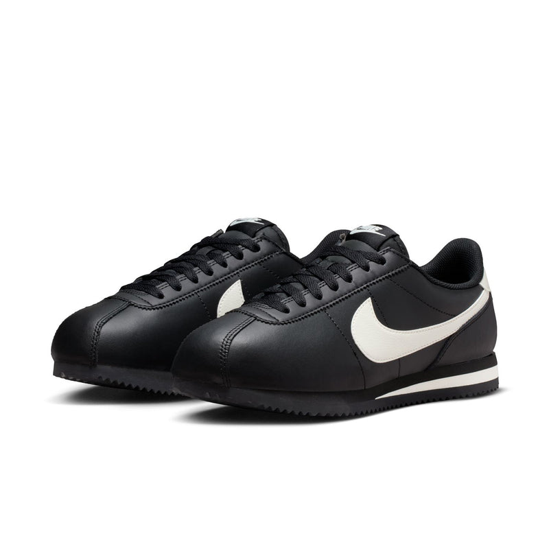 Women's NIKE Cortez sneakers, black with white swoosh, lace-up design