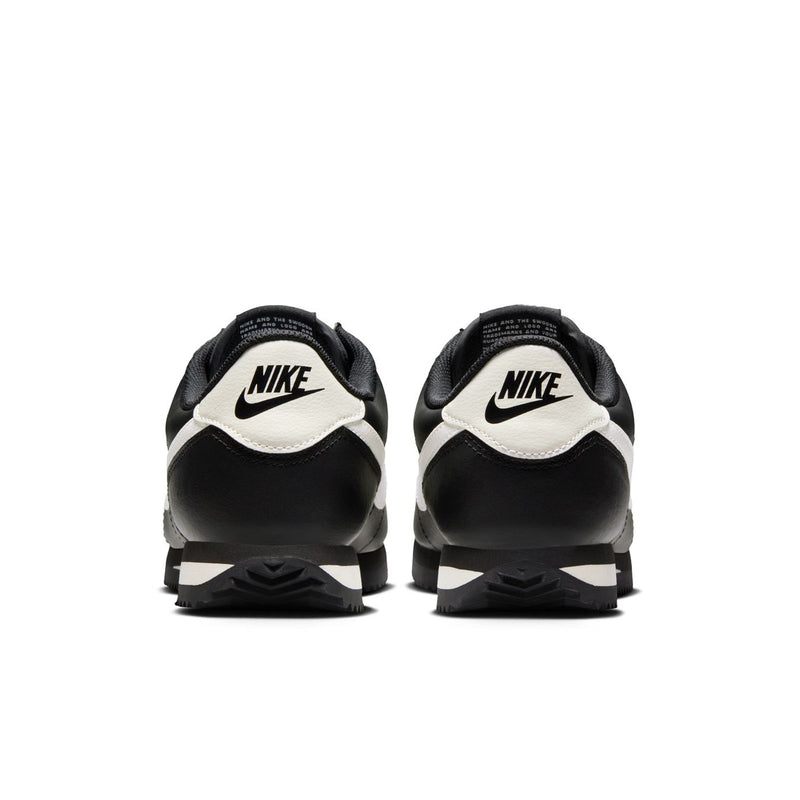 Women's NIKE Cortez sneakers, black uppers with white heel accents and back NIKE logos