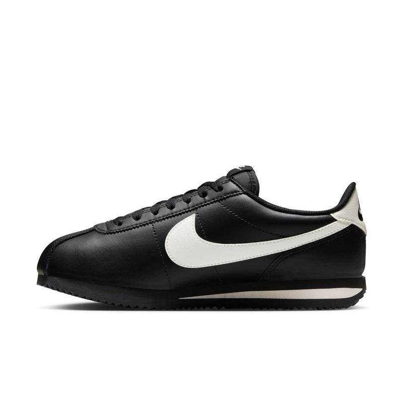Women's NIKE Cortez sneakers, black leather with white swoosh, side profile