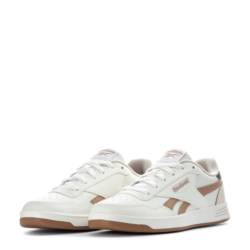 Pair of Women’s Reebok low-top sneakers, white with tan panels and lace-up front.