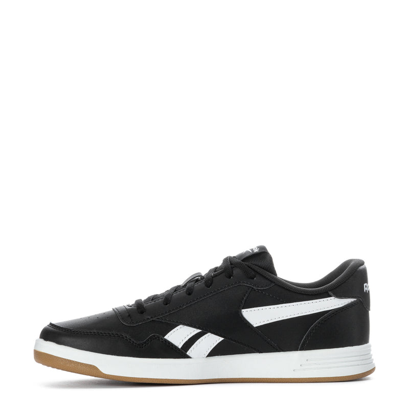 Black youth Reebok Court Advance sneakers with white mid-panel stripes and gum sole.