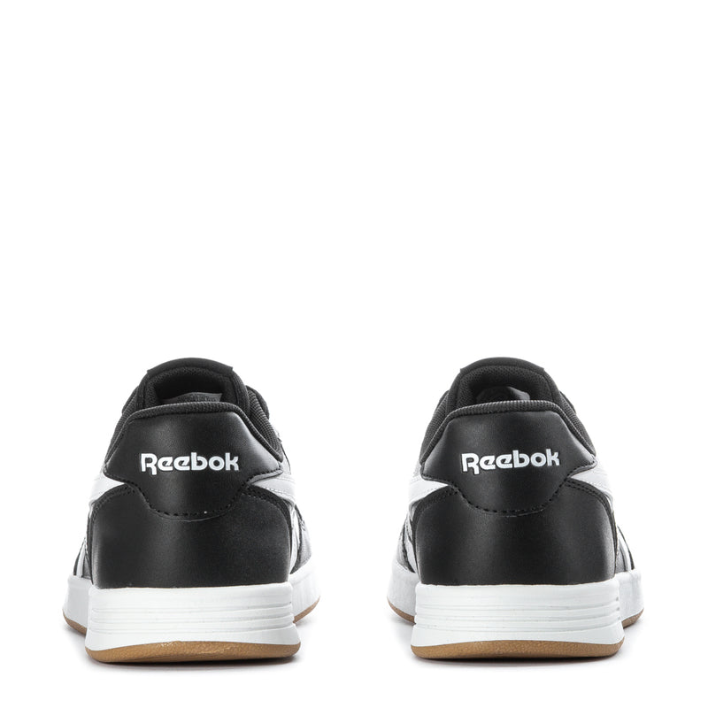 Black youth Reebok Court Advance sneakers with heel branding, white sidewall, gum outsole.