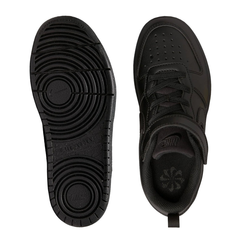Kids black sneakers soles view with textured tread and stitched side panel