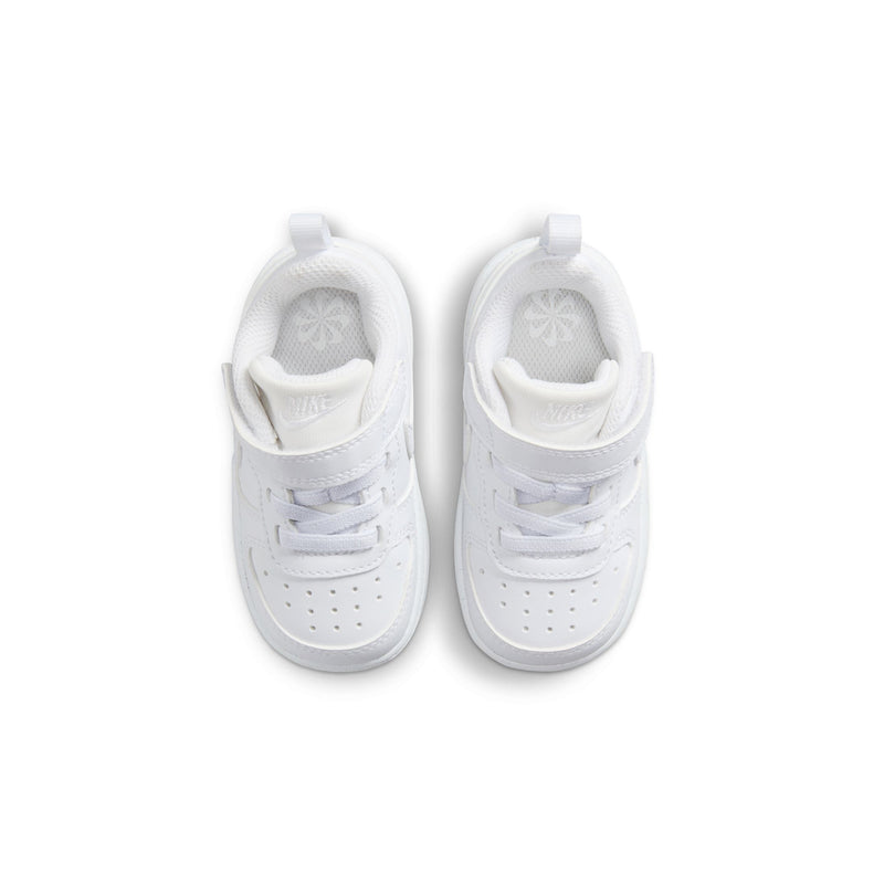 Toddler white sneakers, front view showing perforations and lace eyelets