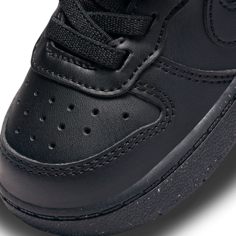 Black toddler sneaker toe and side panels with perforations and stitched overlays