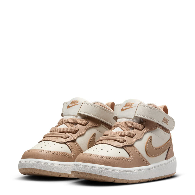 Toddler mid-top sneakers, pair view, pale ivory with tan overlays and Nike swoosh