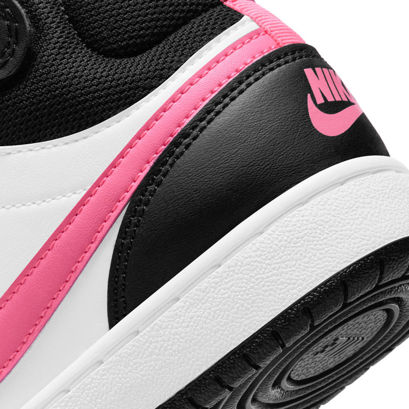 Youth sneaker side close-up with pink strap, Nike swoosh, and black leather panel