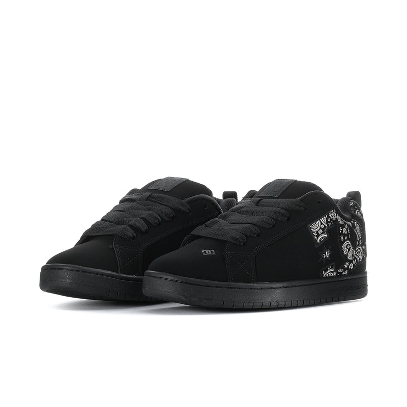 Black low-top lace-up sneakers with patterned collar detail and flat rubber sole.