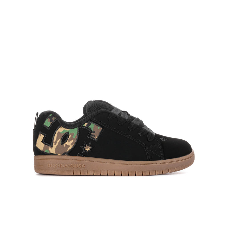 Youth black low-top skate shoes with camo side patch and gum rubber sole