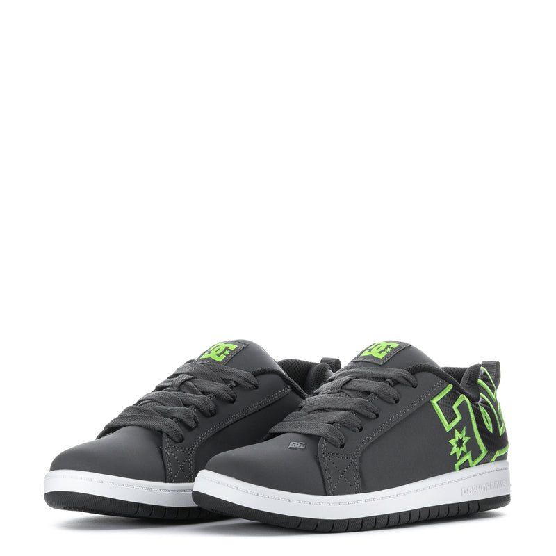 Pair of youth court sneakers with dark grey uppers, neon green side graphics, and laces