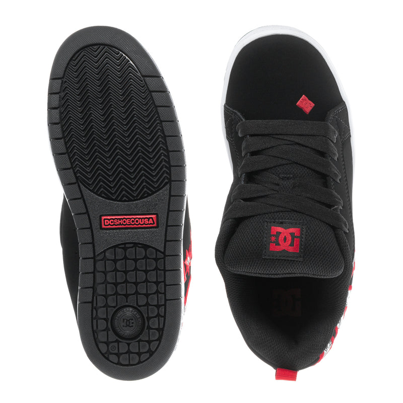 Youth black sneaker outsole and upper view with red DC logo on tongue