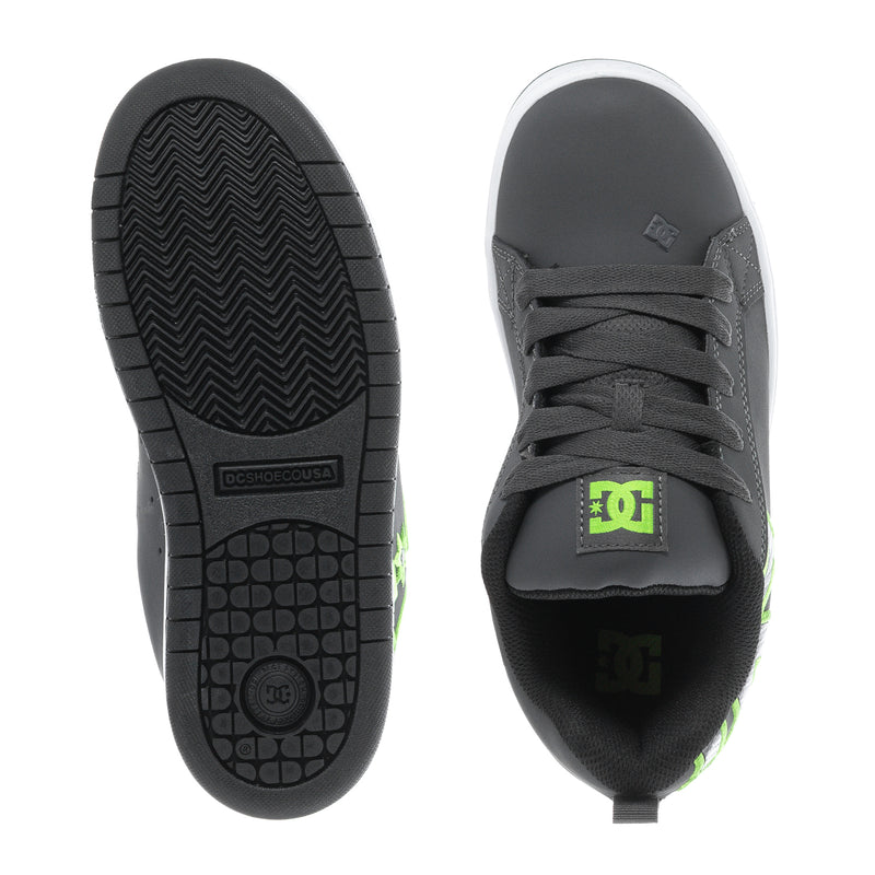Youth court sneakers showing outsole and toe: dark grey with neon green logo on tongue
