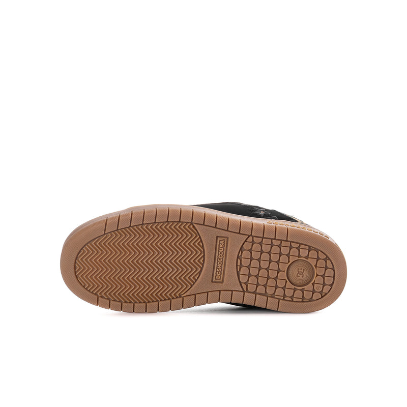Youth black skate shoe outsole with gum rubber tread and grip pattern