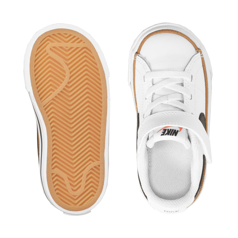 Toddler sneaker outsole and inner view, white with tan tread and lace-up front