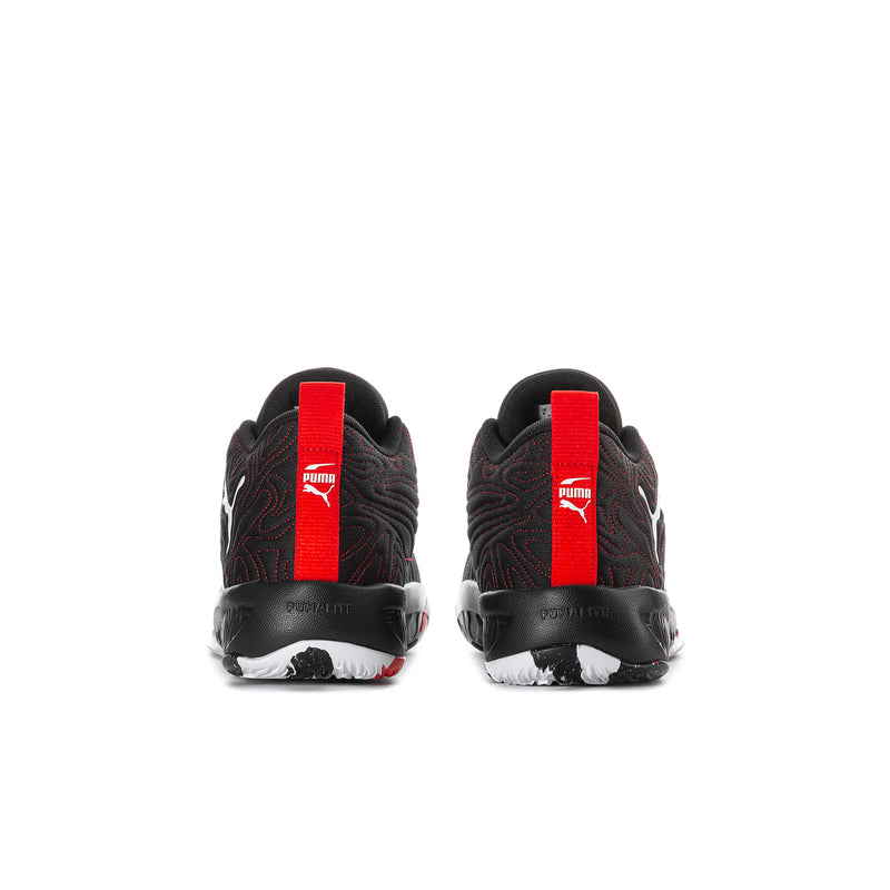 Youth basketball shoes, black knit with red heel tabs, PUMA logos on back.