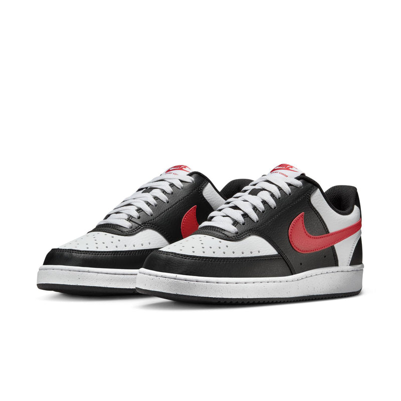 Women's low-top sneakers, black and white with red swooshes, lace-up pair.