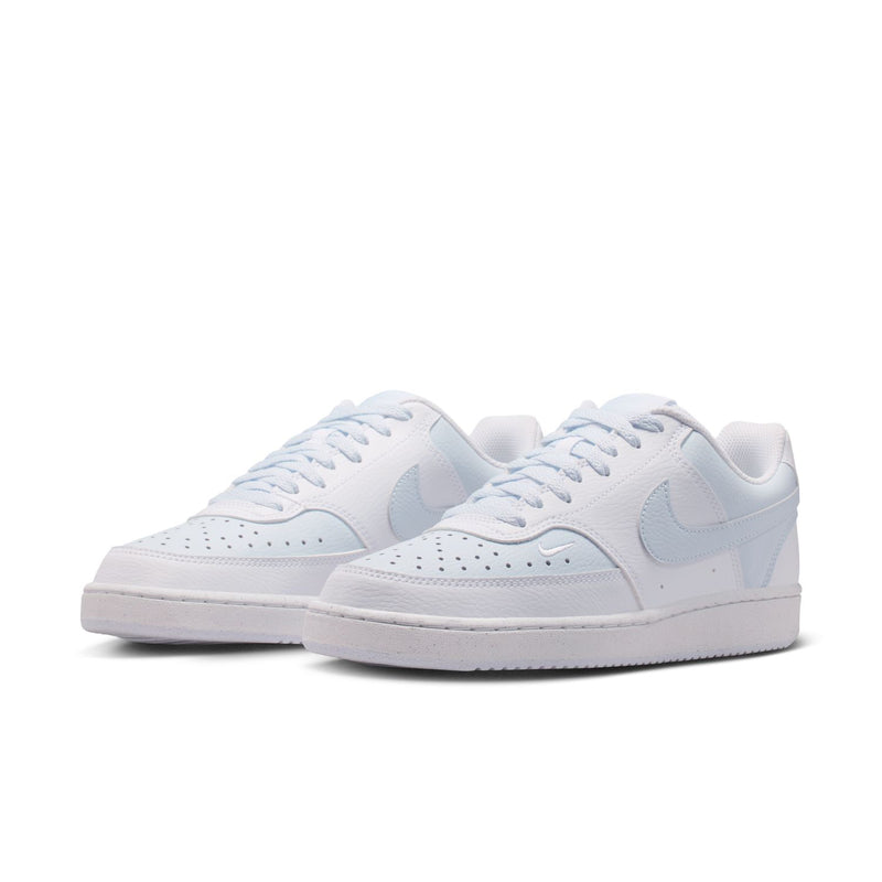 Pair of women's low-top sneakers in white with light blue accents, side view.