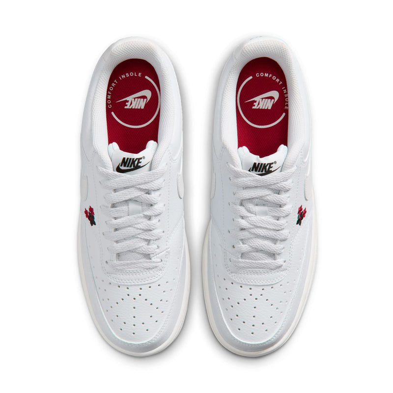 Off-white low-top sneakers with white laces and red-lined Nike tongue labels