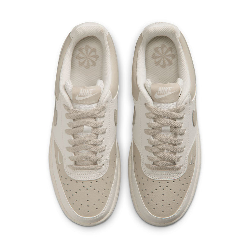 Pair of cream low-top sneakers showing padded tongue and insole branding