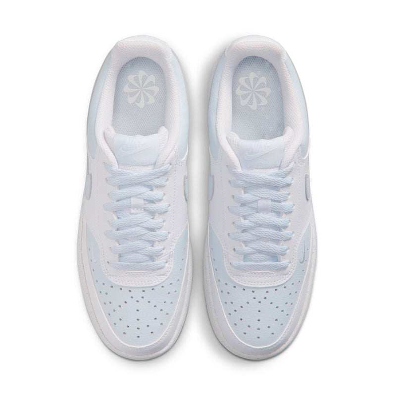 Women's white low-top sneakers, top view of two shoes with light blue lining.