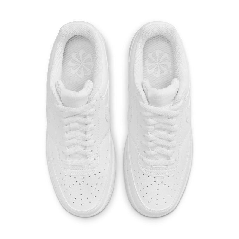 White sneakers front view with perforated toe box and lace eyelets