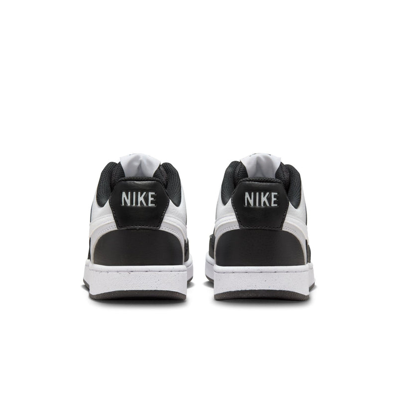 Women's sneakers, heel view; black heel panels with NIKE logo and white midsole