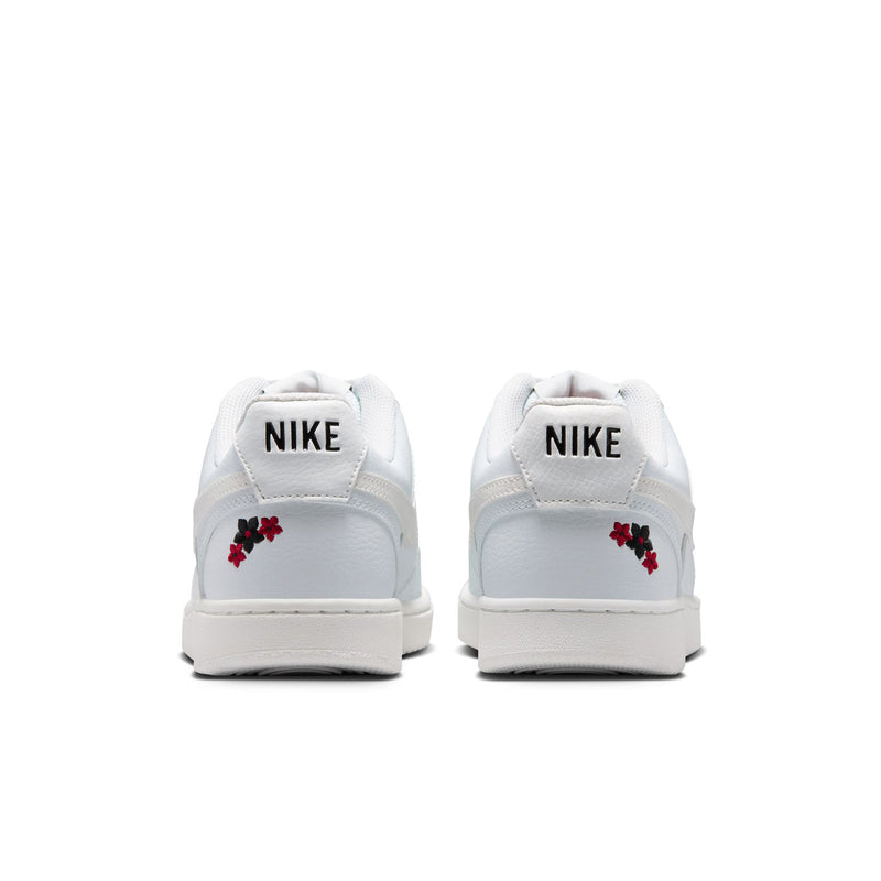 Off-white low-top sneakers with embroidered red flower on heel and Nike branding
