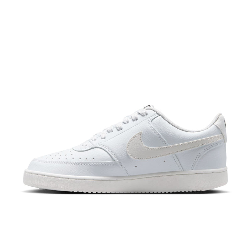 Off-white low-top sneaker with cream Nike swoosh and red flower side embroidery